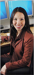 Health-care worker in front of computer.